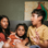 adult and two children talking