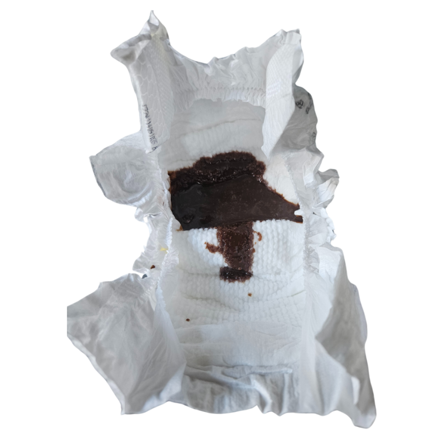 An open nappy with a very dark brown, sticky poo inside.